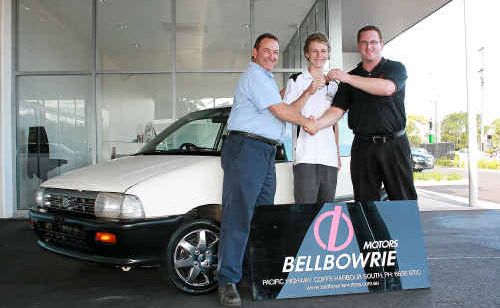 Coffs Sporting Car Club president Scott Bedford and junior club representative Glenn Bedford are handed the keys to the Alto by Craig Ranson from Bellbowrie Motors. Coffs Sporting Car Club president Scott Bedford and junior club representative Glenn Bedford are handed the keys to the Alto by Craig Ranson from Bellbowrie Motors.